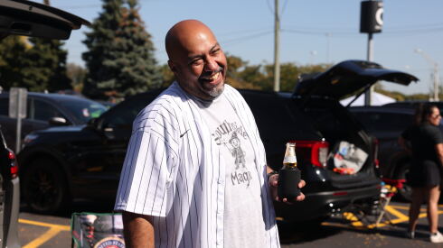 Miguel Vasquez laughs while tailgating outside Rate Field.