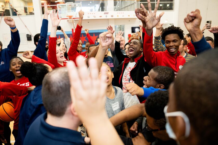 Beautiful Lives Project participants cheer during the Court of Dreams event at the University of Illinois Chicago’s Flames Athletic Center in the Little Italy neighborhood, Thursday, Oct. 19.