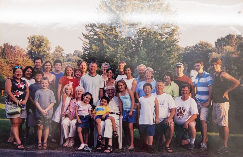 Robert Heinzen, seated in the center, with his family.