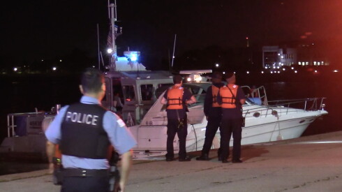 Authorities investigate after two boats crashed in Monroe Harbor shortly before midnight Thursday, leaving at least one woman dead.