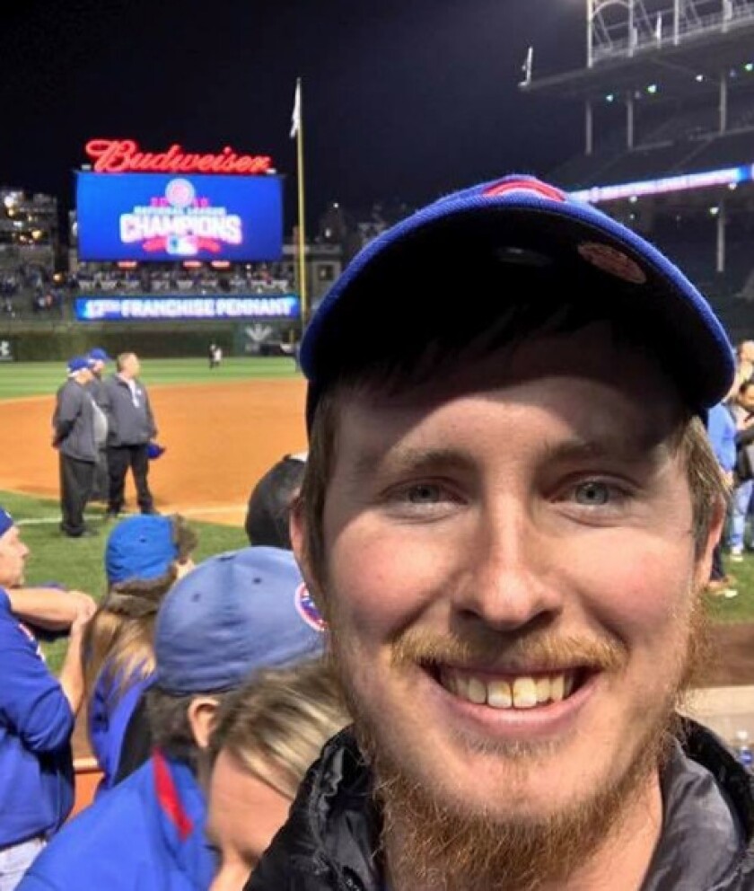 Andrew Grexa shook out a Ziploc bag filled with some of his dad’s ashes at Wrigley Field after the Cubs clinched the pennant. | Facebook