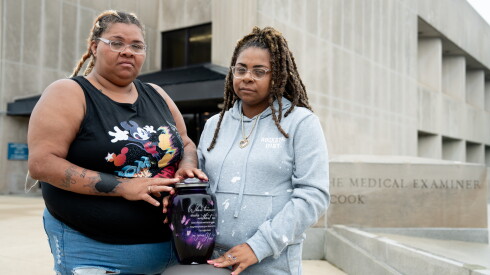 Sisters Franquella (left) and Marshawna Campbell with their mother’s urn outside the Cook County Medical Examiner’s Office on Saturday, Aug. 15, 2026.