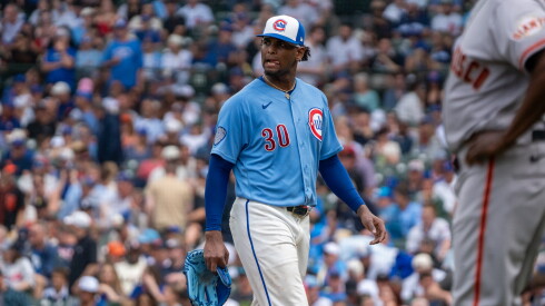 Chicago Cubs pitcher Edward Cabrera walks to the dugout after being pulled from the game.