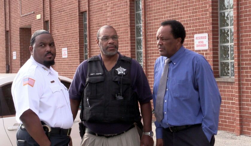 Dolton police Chief Ernest Mobley (from left), Detective Darryl Hope and village trustee Andrew Holmes at a news conference regarding shootings last summer.