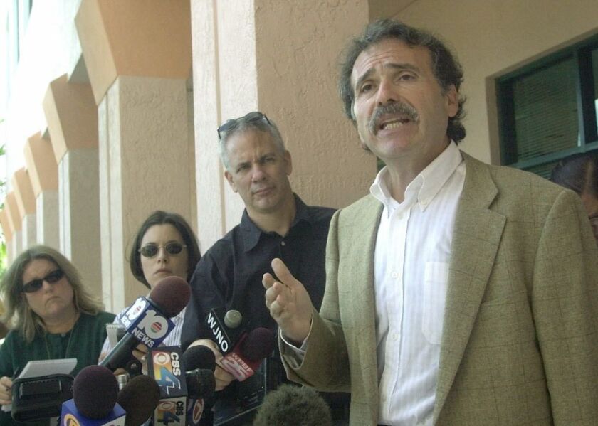 American Media Inc. chairman and CEO David Pecker, right, outside the company’s headquarters in Boca Raton, Fla. | AP file photo