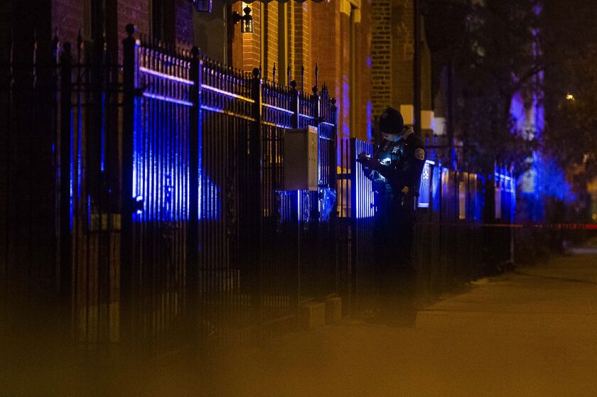 Police investigate the scene where a man was shot and killed Saturday night, in the 1300 block of West Huron Street, in the West Town neighborhood. | Tyler LaRiviere/Sun-Times