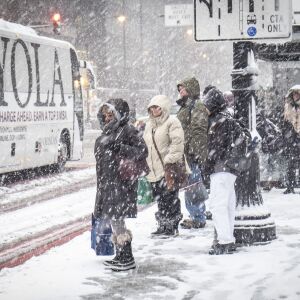 Morning commuters wait for CTA busses near Union station. | Rich Hein/Sun-Times
