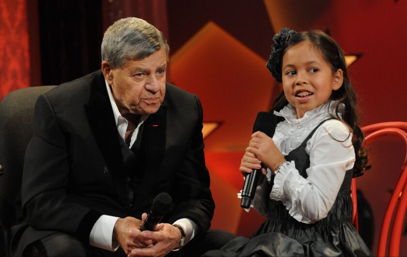 Jerry Lewis chats with Muscular Dystrophy Association National Goodwill Ambassador Abbey Umali during the 2009 Labor Day Telethon. | MUSCULAR DYSTROPHY ASSOCIATION