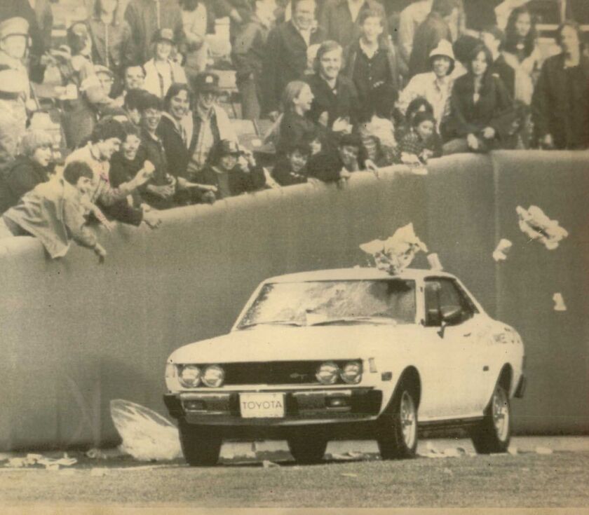 Fans shower refuse on car carrying Oakland A’s relief pitcher Rollie Fingers from the bullpen of New York’s Yankee stadium in the ninth inning of second game Sunday, Fingers, who turned in a sparkling relief job in the first game, lost the second of the d