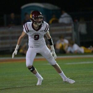 Loyola’s Cam MacIntosh (9) chases Brother Rice’s running back. Worsom Robinson/For the Sun-Times.