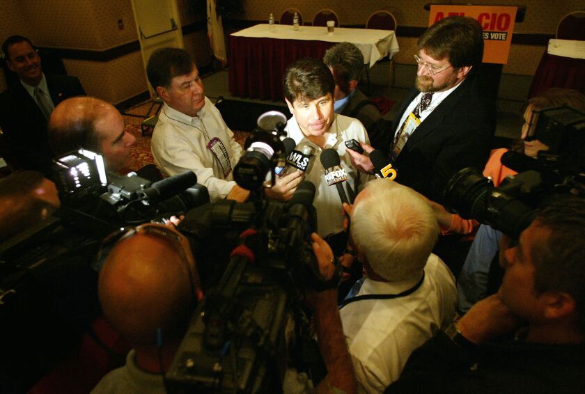 Gov. Rod Balgojevich speaks with reporters at the 2004 Democratic National Convention in Boston.