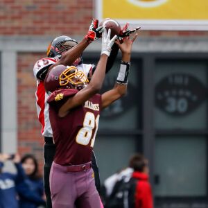 Phoenix’s Lavelle Parker (18) catches the ball before scoring a touchdown against Marine.