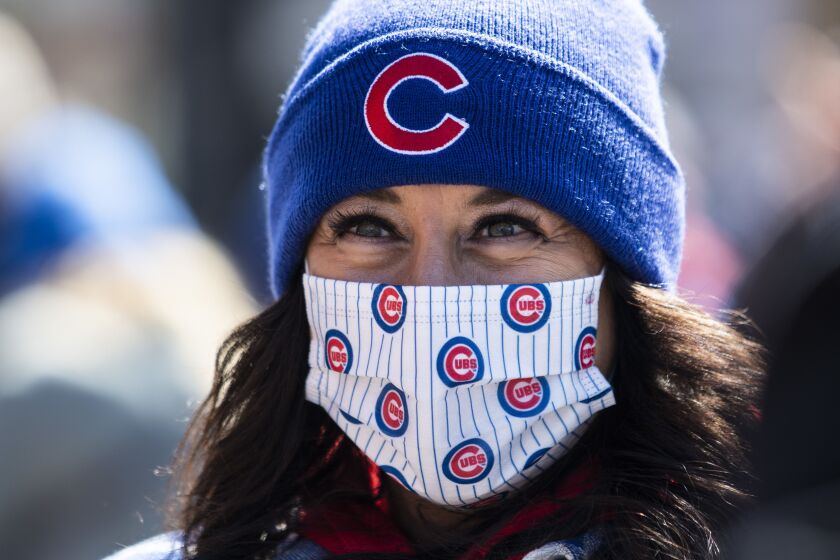 Carla Piunti, 50, of Chicago Heights, smiles as she prepares to enter Wrigley Field before the Chicago Cubs Opening Day game against the Pittsburgh Pirates.