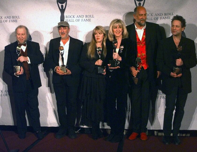 Members of Fleetwood Mac hold their awards after the group was inducted into the Rock and Roll Hall of Fame, in New York in 1998. From left: Peter Green, John McVie, Stevie Nicks, Christine McVie, Mick Fleetwood and Lindsey Buckingham.