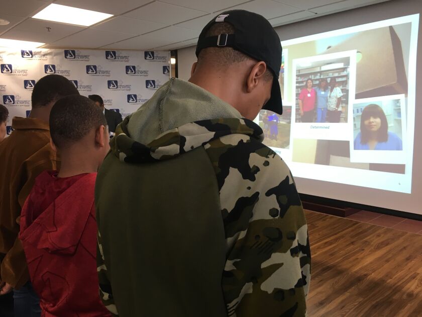 Candice Dickerson’s three sons attended a ceremony honoring their mother at Norwegian American Hospital.