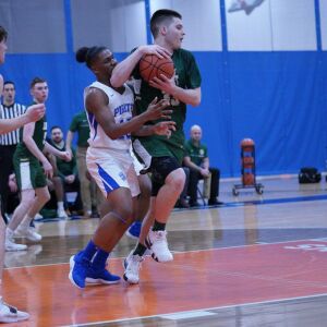Proviso East’s Keashon Fancher (15) battles Lane’s Vuk Djuric (33) for a rebound, Wednesday 02-27-19. Worsom Robinson/For Sun-Times