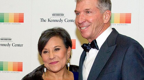 pritzkertraubert012217.jpg WASHINGTON, DC - DECEMBER 03: United States Secretary of Commerce Penny Pritzker and her husband, Dr. Bryan Traubert, arrive for the formal Artist's Dinner honoring the recipients of the 39th Annual Kennedy Center Honors hosted by United States Secretary of State John F. Kerry at the U.S. Department of State on December 3, 2016 in Washington, D.C. The 2016 honorees are: Argentine pianist Martha Argerich; rock band the Eagles; screen and stage actor Al Pacino; gospel and blues singer Mavis Staples; and musician James Taylor.