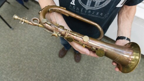 Jeffrey Stockham, musician for The Newberry Consort, holds his keyed bugle made in 1810 during a rehearsal for Revolution! in Gage Gallery at Roosevelt University, on May 4, 2026.