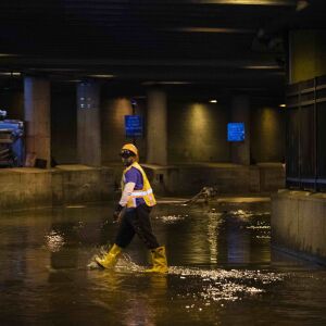 City workers remove water from Lower Wacker Drive near Randolph Street after overnight flooding, Monday morning, May 18, 2020.