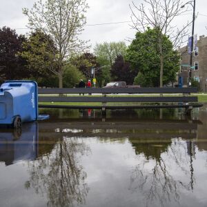 Waters flood around a bench at Humboldt Park, Monday, May 18, 2020. Much of the Chicago area experienced flooding after rain showers over the weekend.