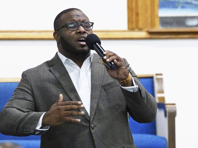 This Sept. 21, 2017, photo provided by Harding University in Search, Ark., shows Botham Jean leading worship at a university presidential reception in Dallas. Authorities said Friday, Sept. 7, 2018, that a Dallas police officer returning home from work sh