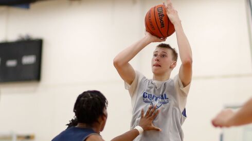 Burlington Central’s Drew Scharnowski (31) shoots against St. Rita at the Riverside-Brookfield Shootout this summer.