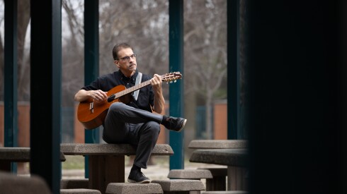 Juan Díes, co-founder of the Sones de Mexico Ensemble, poses for a portrait on Saturday, March 21, 2026 outside the Arturo Velasquez Westside Technical Institute, where he teaches guitar.