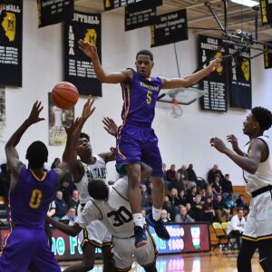 Marian Catholic’s Breion Hill (30) is called for a foul. Worsom Robinson/For the Sun-Times.