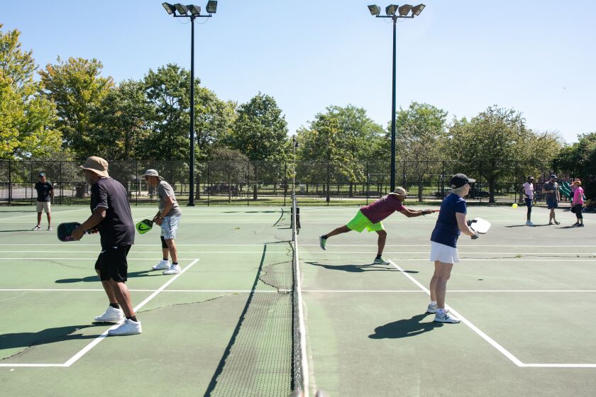 A group plays pickleball at Mandrake Park on the South Side, Wednesday, Aug. 31, 2022. The group, composed mostly of older adults, typically meet thrice a week to play the sport, which they say keeps them healthy and creates a community.