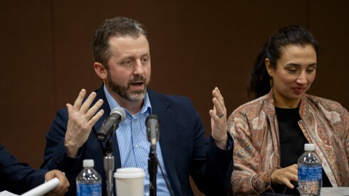 Matt DeMateo, who testified during the Illinois Accountability Commission’s first hearing, speaks beside Dr. Rohini J. Haar, who is an expert at less lethal and crowd control weapons, at Arturo Velasquez Institute at Richard J. Daley College in the Lower West Side, Thursday, Dec. 18, 2025.