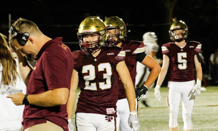 St. Ignatius linebacker/running back Vinny Rugai on the sidelines during the win against Mount Carmel.