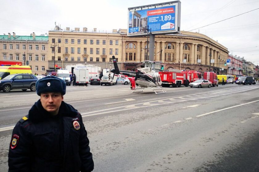 Emergency vehicles and a helicopter are seen at the entrance to Technological Institute metro station in Saint Petersburg on April 3, 2017. | Getty Images