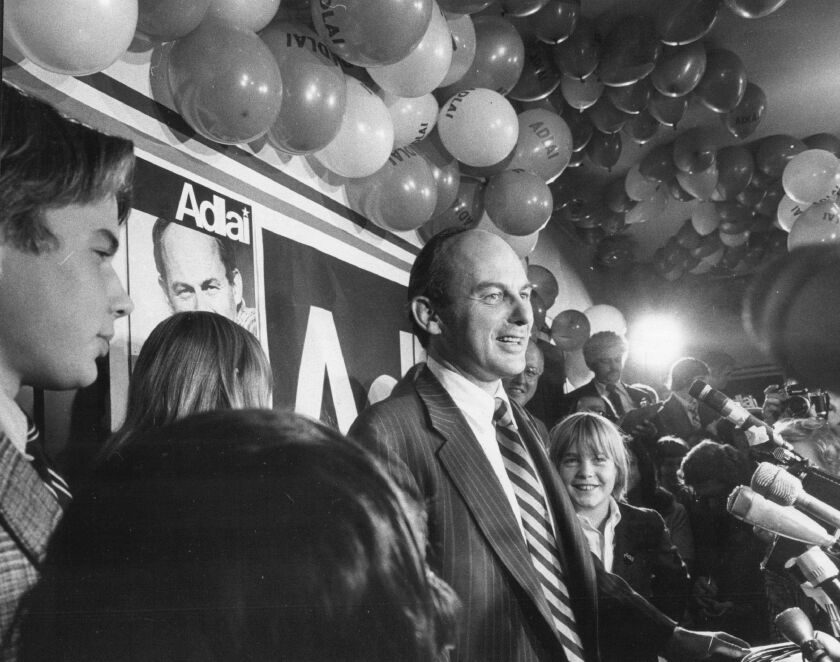 Sharing platform with his children, U.S. Sen Adlai E. Stevenson III celebrates a reelection victory in 1974.