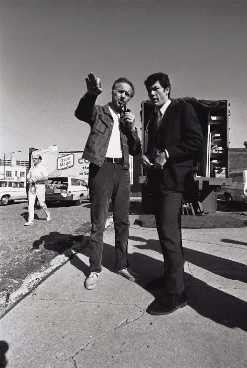 Cinematographer Haskell Wexler directs actor Robert Forster in his 1969 cinema verite film “Medium Cool,” shot amid the protests of the 1968 Democratic convention. | Photo provided by family