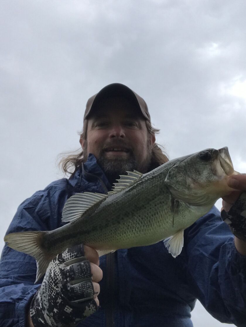 Ken “Husker” O’Malley with a largemouth bass from local waters. Provided photo