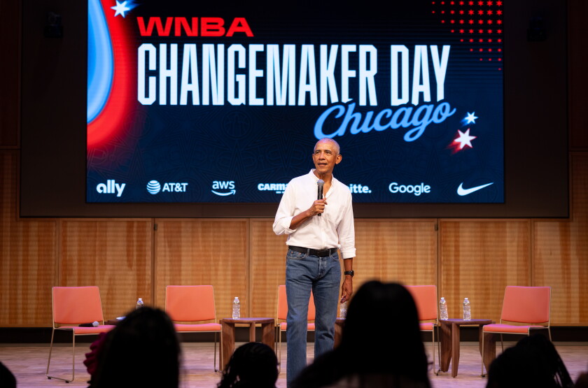 Former President Barack Obama surprises a group of high school freshman girls Friday during the WNBA Changemaker Day at the Obama Presidential Center in Jackson Park on the South Side.