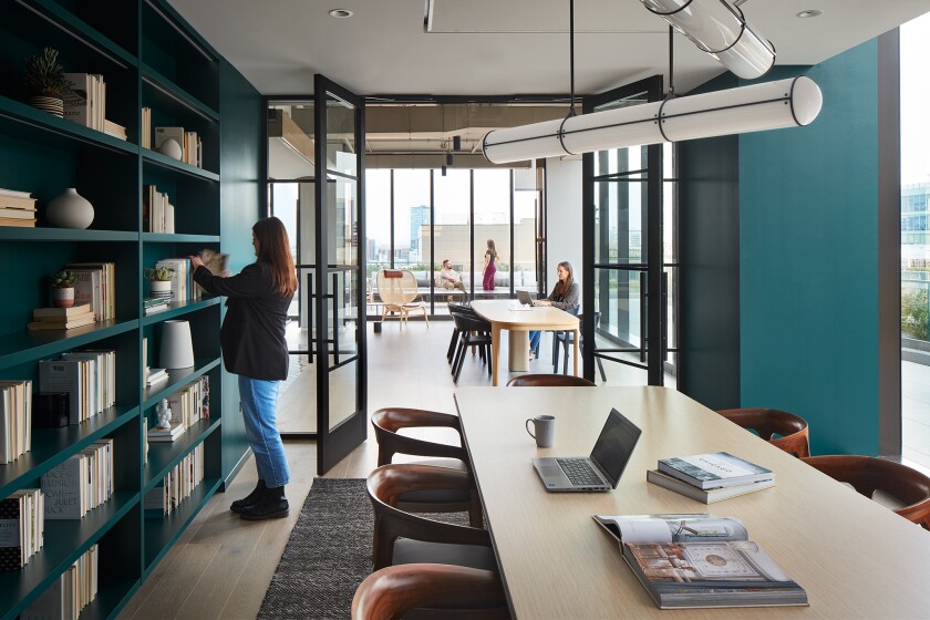 Rendering of KI's Fulton Market showroom with conference tables and bookshelves.