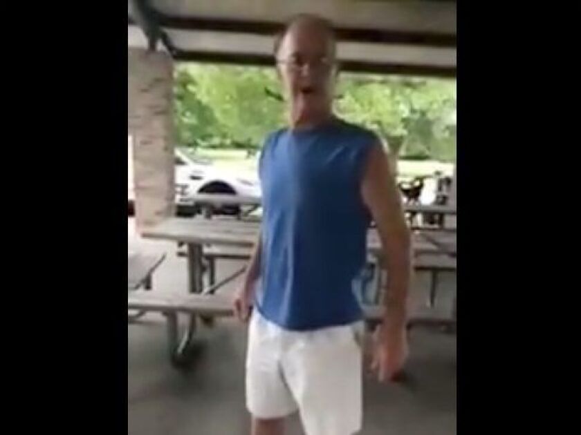 Screen image of man yelling at woman for wearing Puerto Rico T-Shirt.