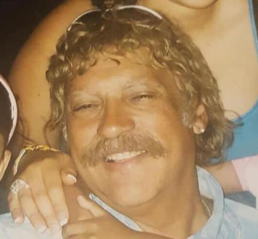 John Garrido Sr. wearing one of the hairpieces he used in his undercover work.