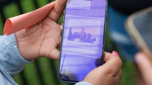 Marshawna Campbell shows a photo of her mother’s cremation certificate to a reporter outside the Cook County Medical Examiner’s Office.