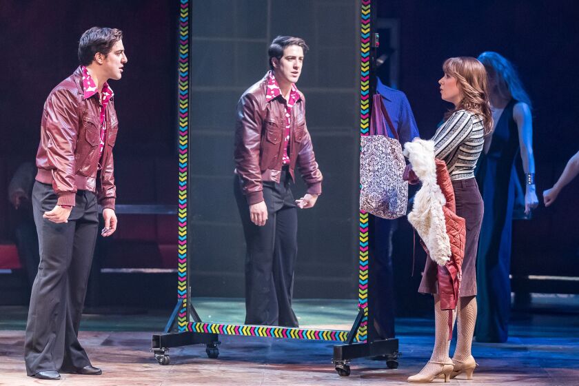 Adrian Agular plays Tony Manero and Landree Fleming plays Annette in the Drury Lane Theatre production of “Saturday Night Fever.” (Photo: Brett Beiner)