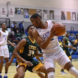 Brooks’ Pierre Poindexter (12) backs down Ag. Science’s Dan Davenport (34), Thursday 01-10-19. Worsom Robinson/For the Sun-Times.