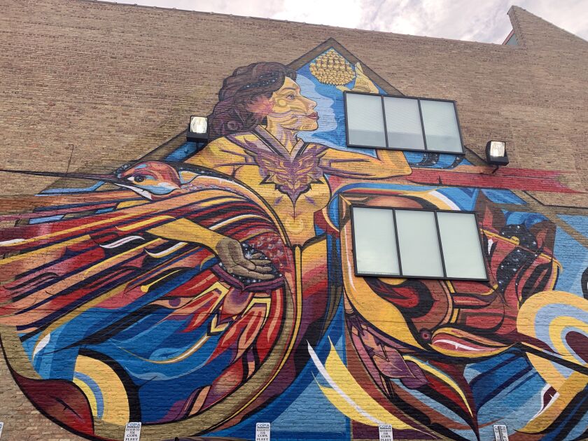 Miguel Del Real’s three-story mural “Embracing Life,” painted in 2018 on a former Goldblatt’s department store near Chicago and Ashland avenues.
