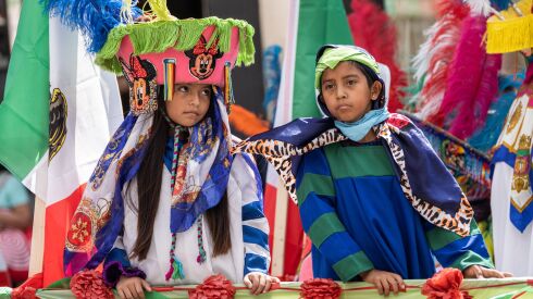 Kids ride a float during the 20th annual Mexican Independence Day Parade along West 18th Street in the Pilsen neighborhood, Saturday afternoon, Sept. 10, 2022.