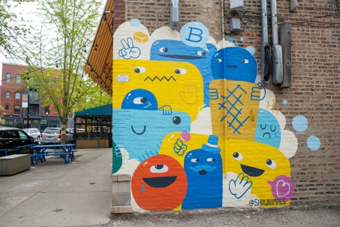 Artist Shawn Smith’s mural is on the side of Bartleby’s Homemade Ice Cream.