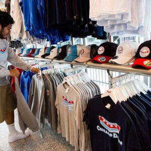 Edson Apaez organizes Chicago Dogs merchandise at Impact Field, May 25, 2018. | James Foster/For the Sun-Times
