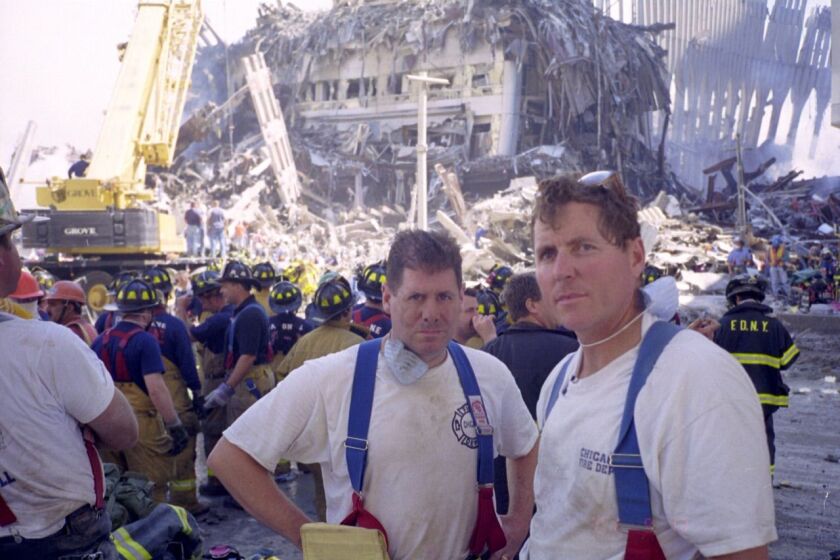 Pat Maloney (left) and fellow Chicago firefighter Jim O’Donnell stand near the site of the 9/11 attacks in New York City. | Provided photo