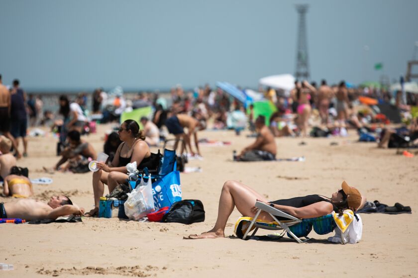 Beach goers flock to Montrose Beach as temperatures rise to 95 degrees Wednesday afternoon.