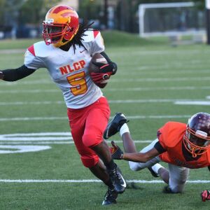 North Lawndale’s Jalen Thorpe (5) shakes off a defender. Worsom Robinson/For the Sun-Times.