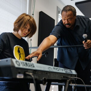 Instructor Felton Crews gives Weston timing instructions during Fernando Jones' 17th annual Blues Camp International at the Music Center of Columbia's School of Audio and Music.